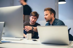 Two Low-Code and No-Code Developers Sitting at a Computer | Alpha Software