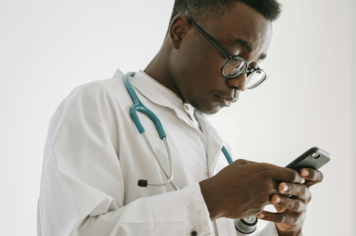 A doctor using a smartphone.