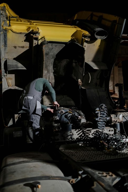 Maintenance supervisor examining mining equipment.