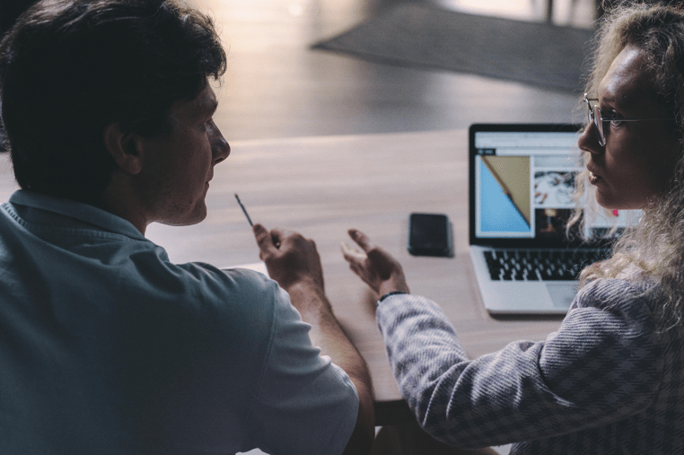 Business team planning digital operations and URL redirect strategies.