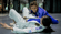 Two women practicing Brazilian Jiu-Jitsu on the mat, illustrating training at a BJJ gym supported by gym management software.