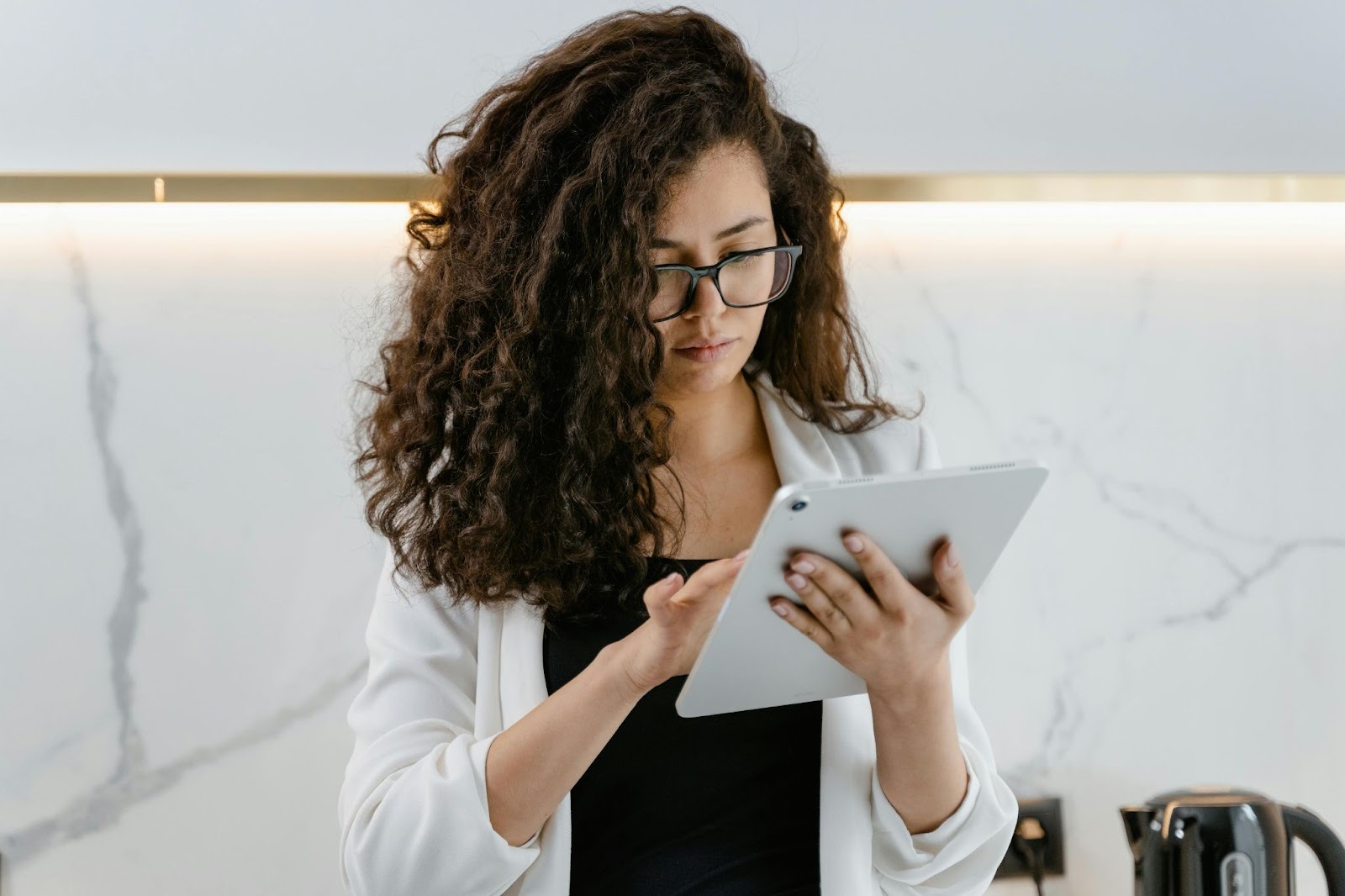 Researcher using a tablet to collect field data with digital forms